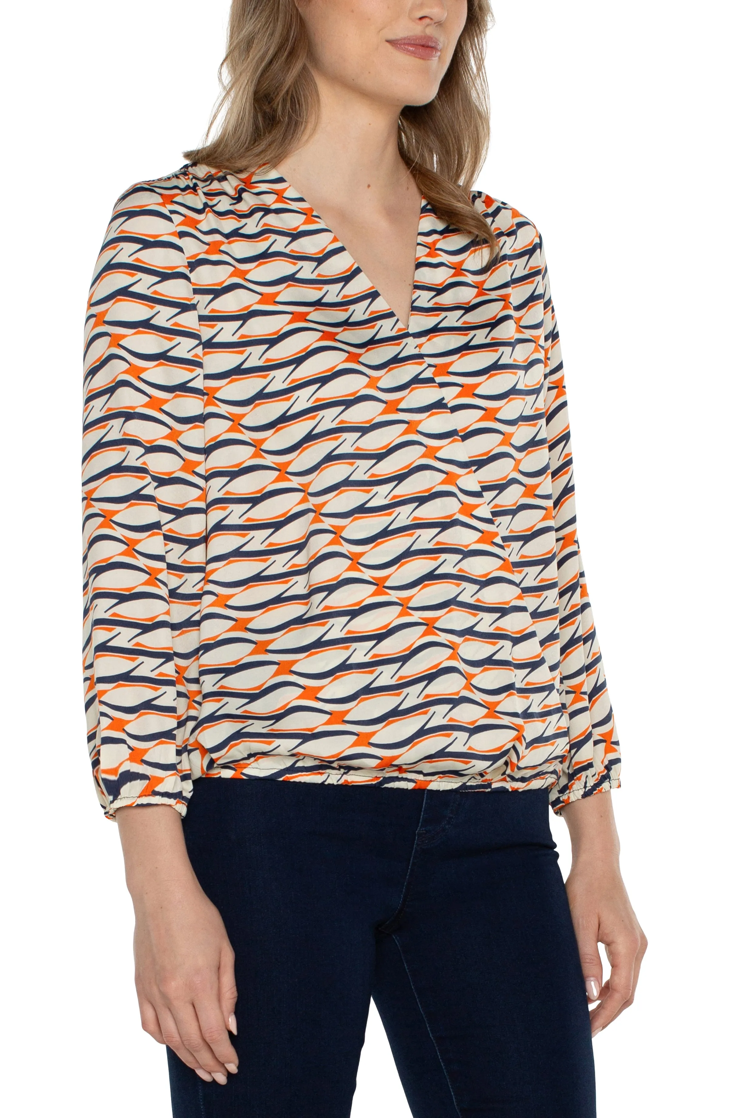 The Danae Geo Print Surplice Blouse